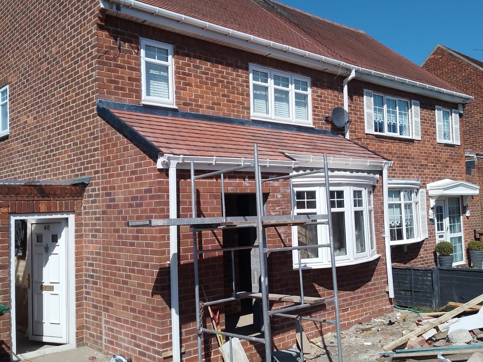 Roofers installing a new roof in the North East